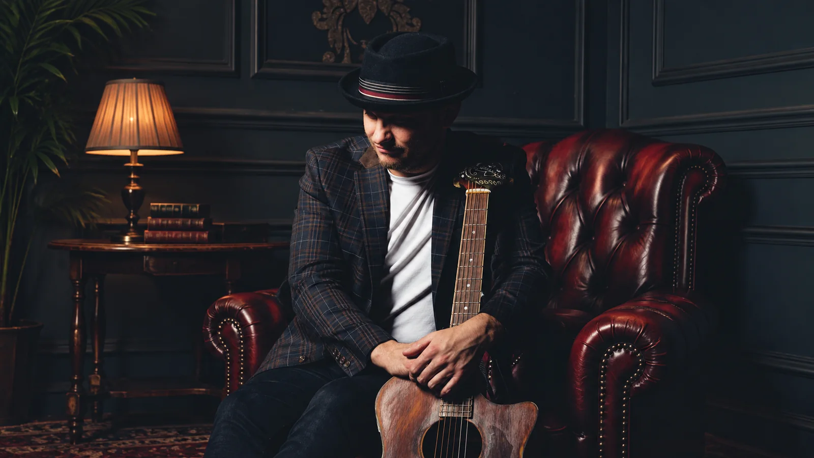 Robert Lavington with his guitar, bass player and vocalist for Hearts in Harmony